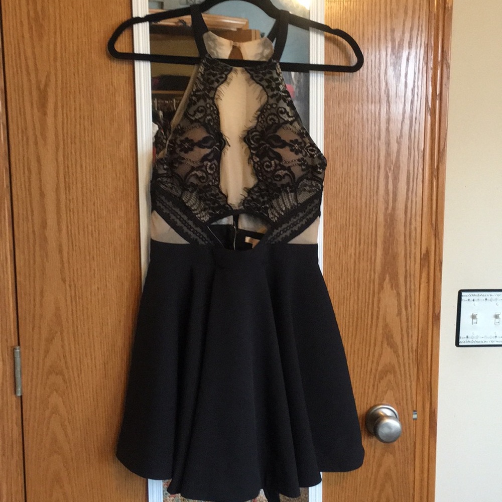 Halter top lace dress with cutout.